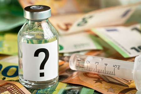 Vaccine bottle with question mark on label, hypodermic syringe needle near and euro banknotes money...