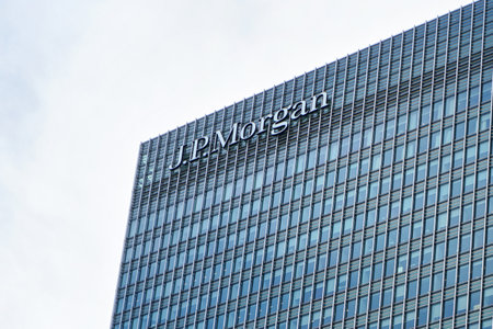 London, United Kingdom - February 03, 2019: Sun shines on J P Morgan signage at top of their UK branch at Canary Wharf. JPMorgan Chase is US multinational investment bank founded (originally) 1799のeditorial素材