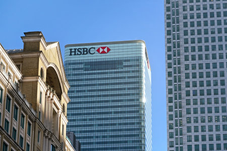 London, United Kingdom - February 03, 2019: Sun shines on world Headquarters of HSBC Holdings plc at 8 Canada Square, Canary Wharf. It is 7th largest bank worldwide, was established in 1865のeditorial素材