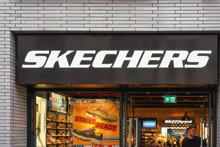 London, United Kingdom - February 01, 2019: White letters logo on Skechers shop at their Oxford Street branch. It is American company selling mostly footwearのeditorial素材