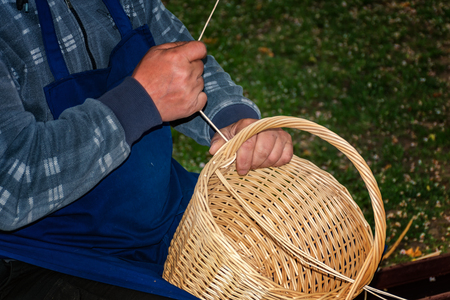 Basket-maker creates a new basket - Folk art の写真素材