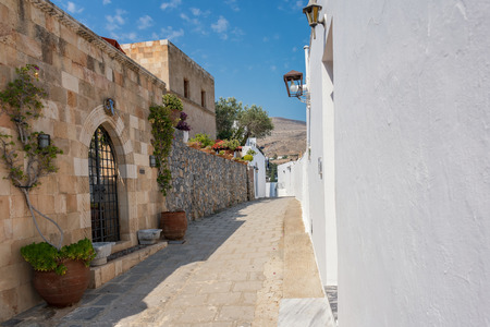 House/villa with flowers on the way to Acropolis of Lindos (Rhodes, Greece)の写真素材