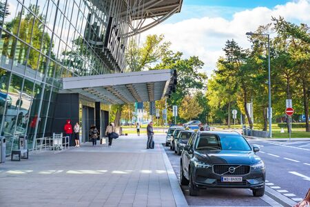 BRATISLAVA, SLOVAKIA â€“ OCTOBER 6 2019: Passengers and cars in front of Departure hall of...