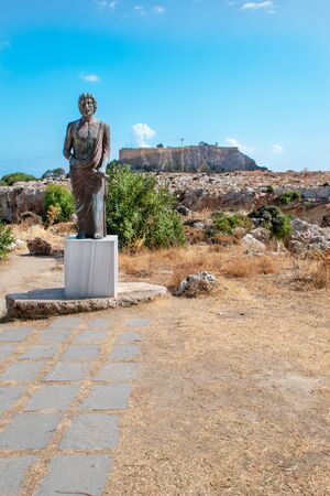 Satue of Cleobulus,  Acropolis of Lindos in background (Rhodes, Greece)の写真素材