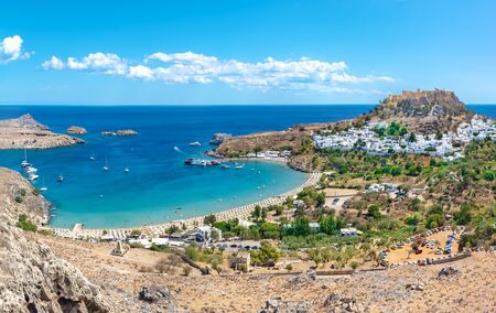 View of Lindos beach with village of Lindos and Acropolis in background (Rhodes, Greece)のeditorial素材