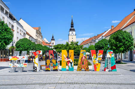 TRNAVA, SLOVAKIA â JUNE 25 2020: pedestrian zone of city centre of Trnava with creative hashtag and with town tower in background.のeditorial素材