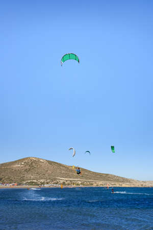 Kitesurfer in big jump in air on Prasonisi beach (Rhodes, Greece)