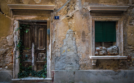 The vintage wall, door and window in a small town in Croatiaの写真素材