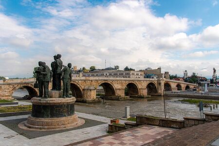 North Macedonian`s capital city Skopje. Ottoman Stone bridge and statue.のeditorial素材