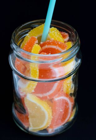tangarine marmalade jam in glass jar. dark food photo style. Christmas winter or autumn mood. Homemade citrus cinnamon and anise stars marmalade.