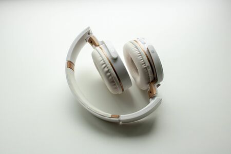 Headphones isolated. White wireless headphones. Front view photo. Isolated on white background.の写真素材