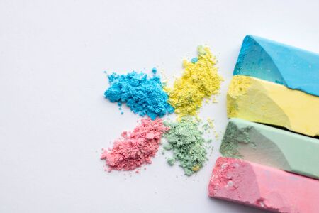 Square colorful pastel chalks tops closeup, on white background.の写真素材