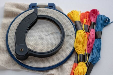 threads of different color magnifying glass whaite backgroundの写真素材