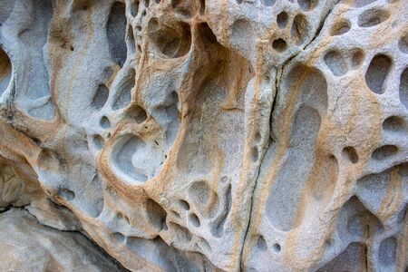 background and texture of mountain layers and cracks in sedimentary rock on cliff face. Cliff of...