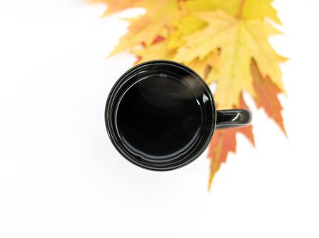 Top view photo of a black tea cup isolated on white backgroundの写真素材