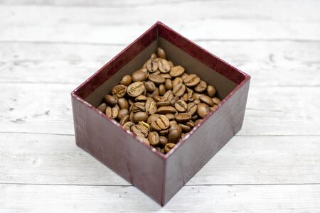 Coffee on grunge wooden background table concept bean