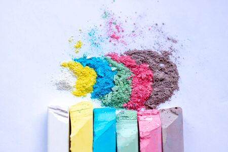 Color chalk powder cyan magenta yellow black isolated on white background texture