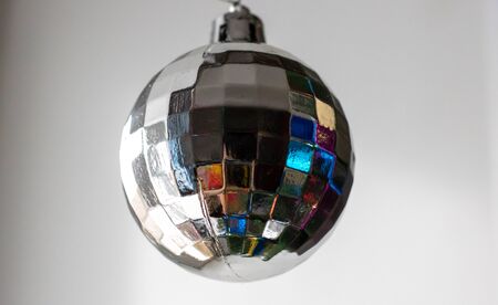 disco ball hanging on chainlet isolated on white.