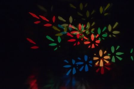 Color Bokeh on a dark background with splatter for use in graphic design.abstractの写真素材