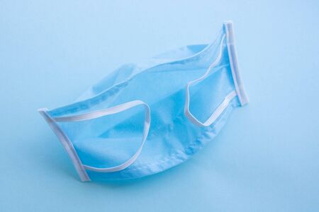 Medical blue mask isolated on a blue background