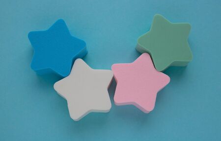 Set of sponge for cleaning face makeup on a blue background.