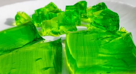 Delicious green jelly cube on white background.の写真素材