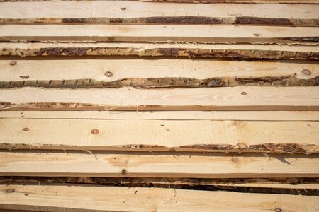 Background of fresh sawn rough boards.Industry