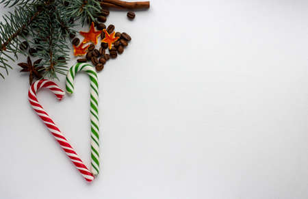 Caramel cane, spruce branch.Concept Of The New Year Of Christmas.Space for your textの写真素材