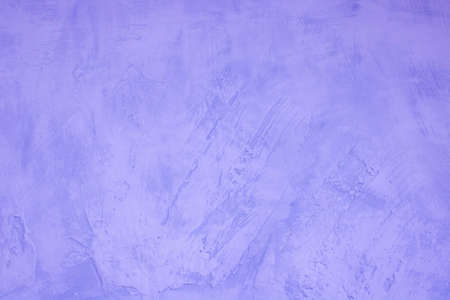Lilac abstract background of rough plastered wall.