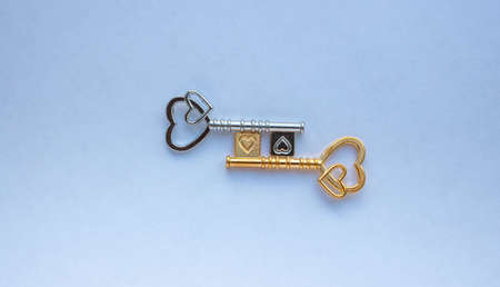 Gold and silver keys isolated on a white background.の写真素材