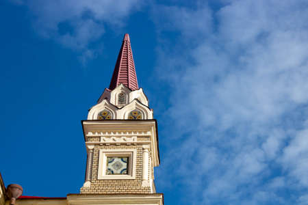 The tower in Rybinsk Russia on the museum building against the blue sky on a clear spring day.