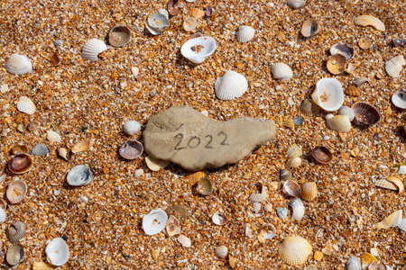 The numbers 2022 on a small gray stoneの写真素材
