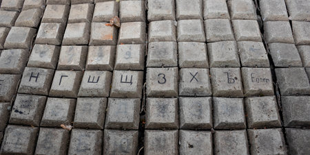 The river banks are reinforced with giant stones as a breakwater against erosion. Stone pavement on the embankmentの写真素材