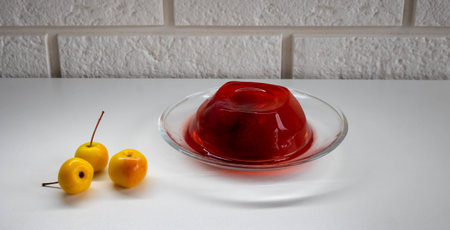 Strawberry jelly with berries, isolated on a white background.の写真素材