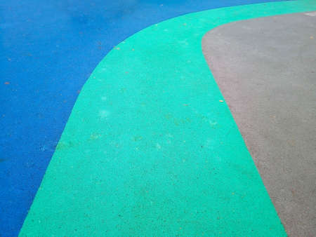 Colorful playground background. Grey-blue rubber outdoor playgroundの写真素材