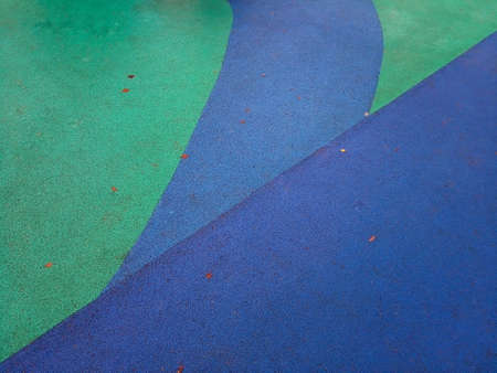 Colorful playground background. Grey-blue rubber outdoor playground