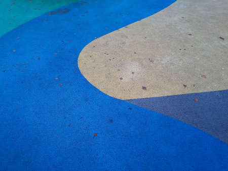 Colorful playground background. Gray-blue rubber outdoor playground.の写真素材