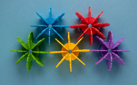 Multicolored plastic construction blocks of the designer on a blue background.の写真素材