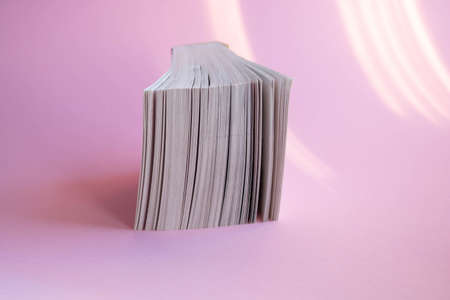 A new tear-off calendar on a pink background.の写真素材