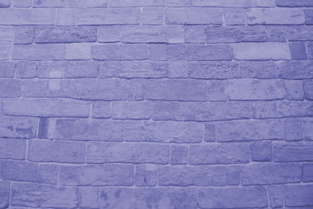 The old brick price is painted lilac. Brick background in panton color very peri