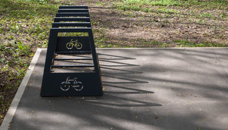 Bike rack in the park in the parking lot on a clear sunny day