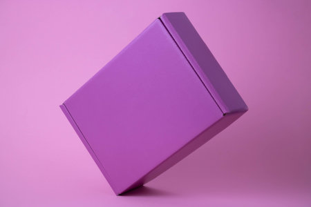 Lilac gift closed box on pink background.の写真素材