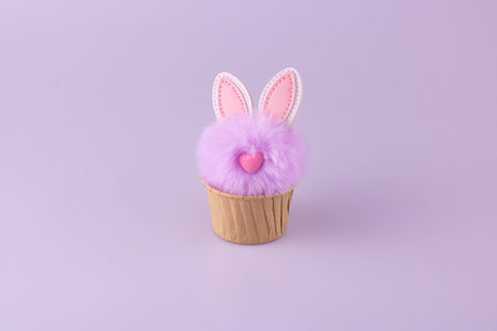 Lilac Fluffy toy rabbit in a cupcake baking Dish.