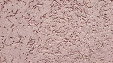 Pink decorative relief. Pink stucco wall. Pink background of the wallの写真素材