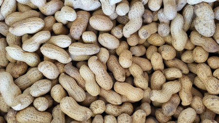 Background of peanuts. Peanuts on the counter of a street market.