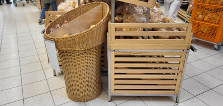 Wicker large basket and shelves for bread in the storeの写真素材