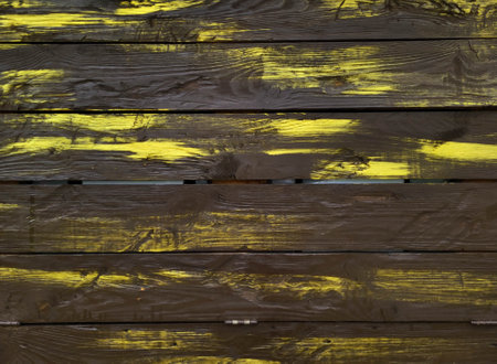 Abstract wooden horizontal brown background with yellow stripesの写真素材