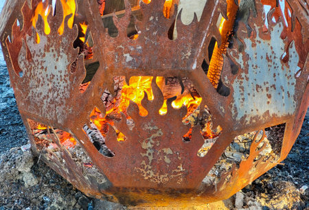 Burning coals in a brazier. Celebration in the city park.の写真素材