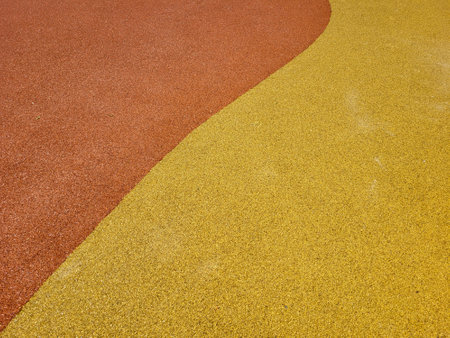 Colorful background of the rubber coating of the outdoor sports ground. View from aboveの写真素材