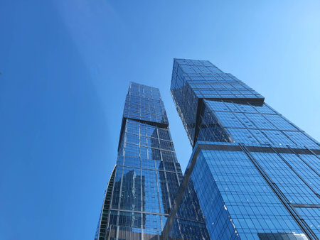 Moscow, Russia, 09:10 2024 Glass towers in the Moscow City business district rise against the blue sky. Modern architecture, backgroundの写真素材